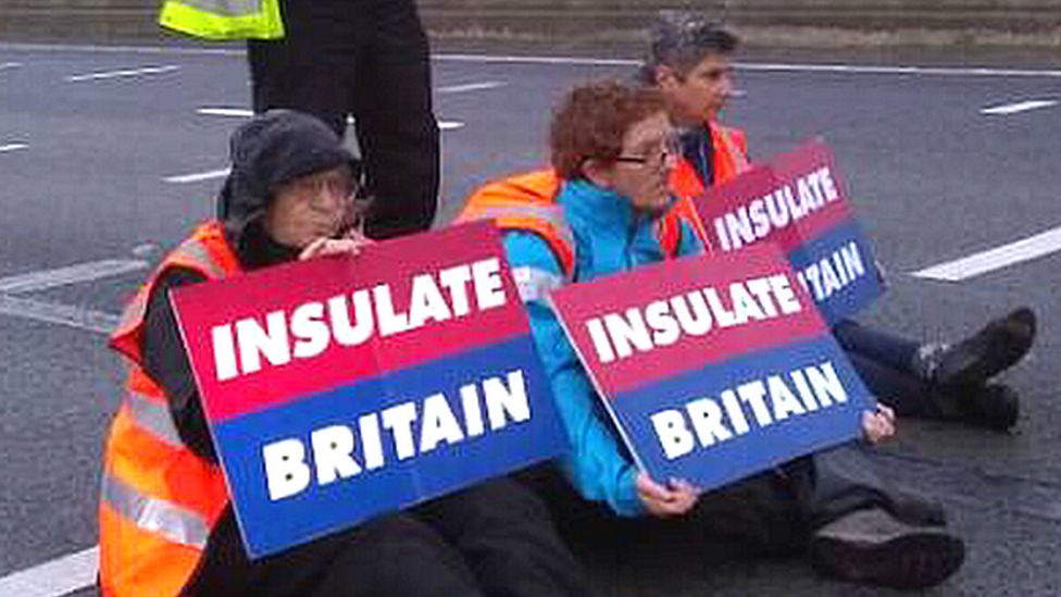Insulate Britain protesters sitting on the M25.