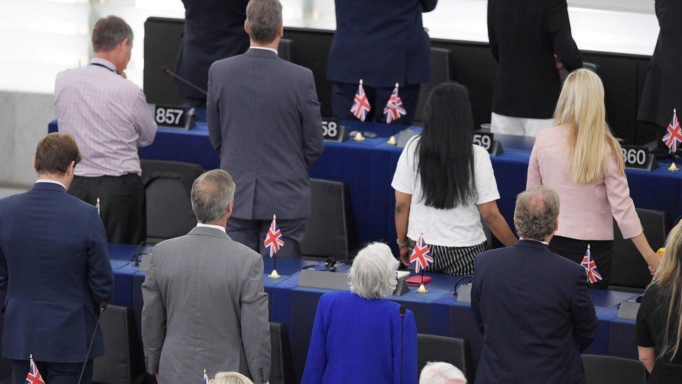 British MEPs from the Brexit Party turn their backs during the European anthem ahead of the inaugural session at the European Parliament on July 2 , 2019 in Strasbourg