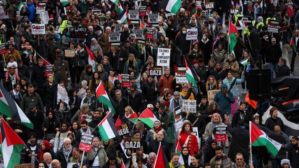 Demonstrators in London march as they protest in solidarity with Palestinians in Gaza