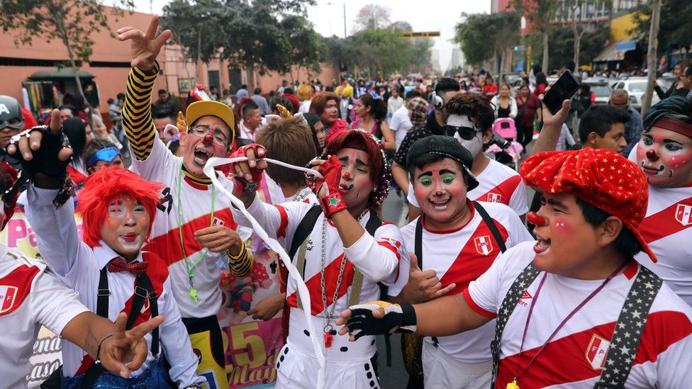 Clowns take part in a parade during Peru's Clown Day celebrations in Lima, Peru May 25, 2018