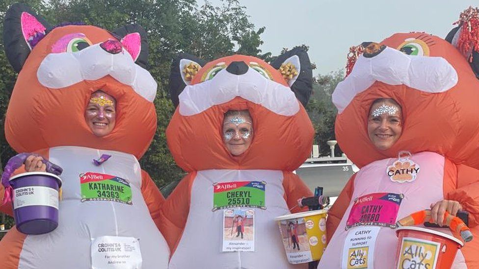Women wearing inflatable cat costumes about to run the Great North Run