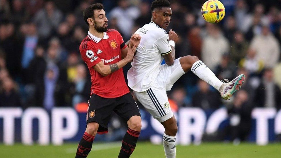 Manchester United's Portuguese midfielder Bruno Fernandes vies with Leeds United's defender Junior Firpo during Sunday's game at Elland Road