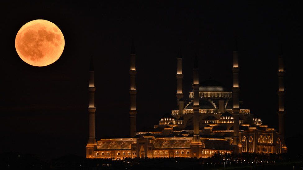 Super moon rises over Grand Camlica Mosque in Istanbul
