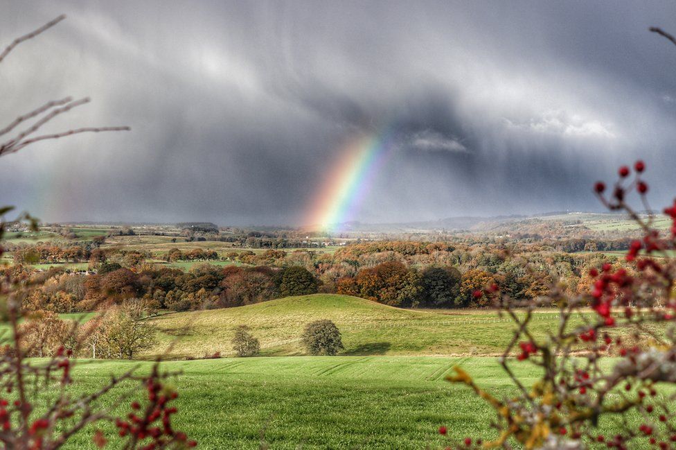 A double rainbow over fields