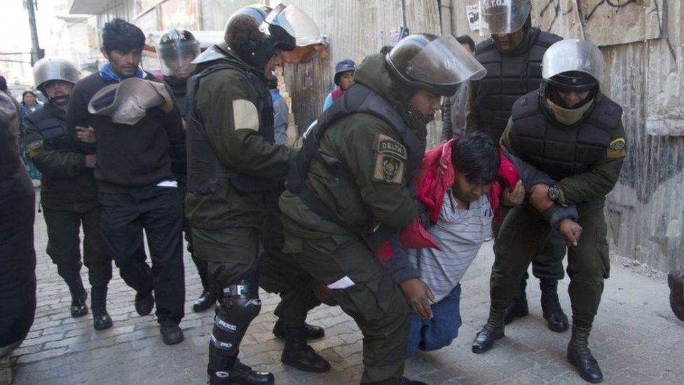 Police detain a disabled protester in La Paz