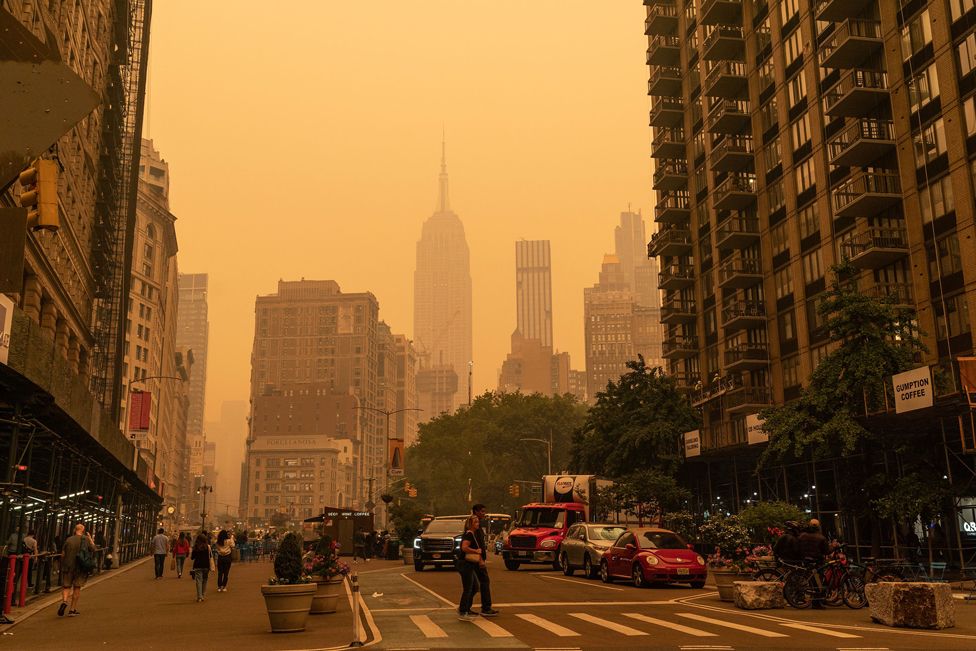 View of hazy New York city skylines during bad air quality because smoke of Canadian wildfires brought in by wind on 7 June 2023