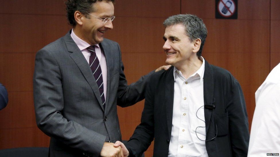 Eurogroup President Jeroen Dijsselbloem shakes hands with Greek Finance Minister Euclid Tsakalotos, 14 Aug