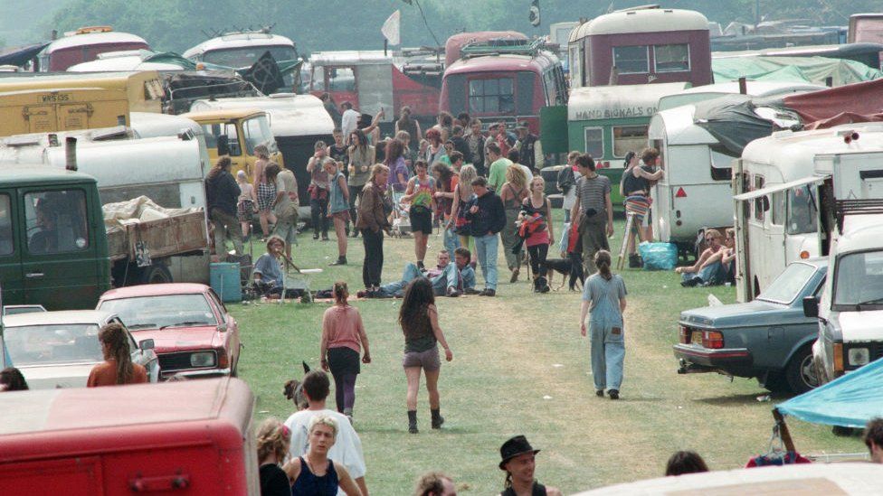 Loads of campervans and people at the rave in Castlemorton