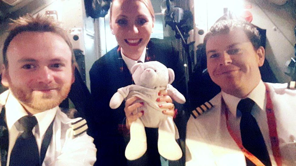 Loganair crew with soft toy