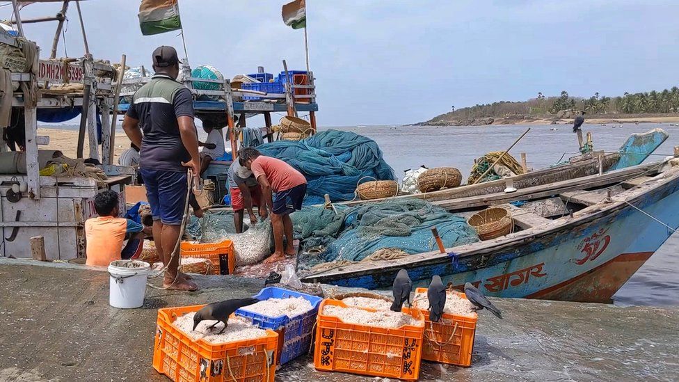 Fishermen seen along the coast of Mumbai