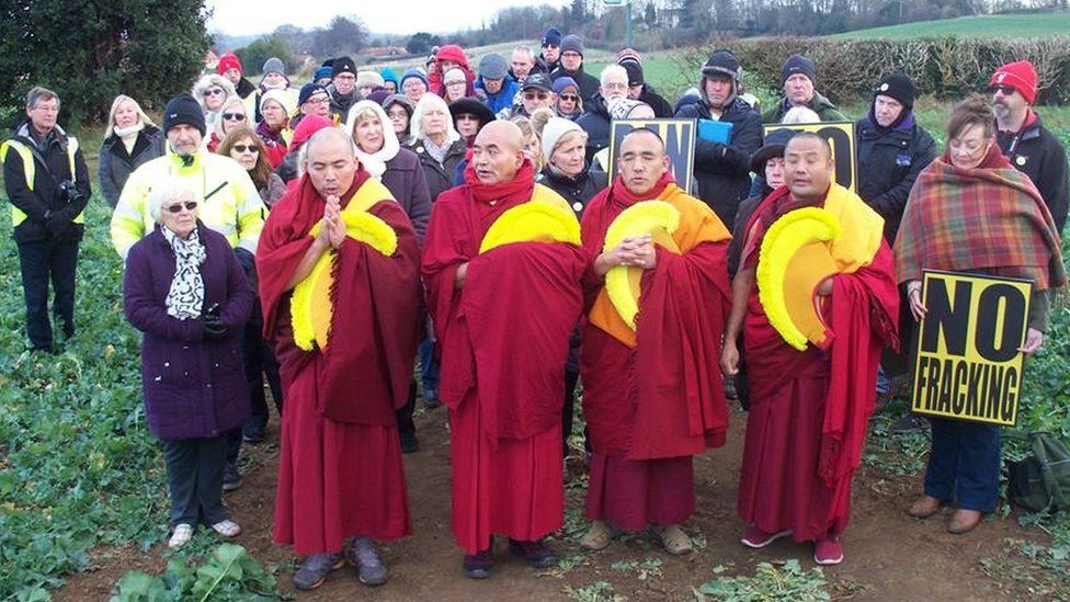 The monks performing the blessing
