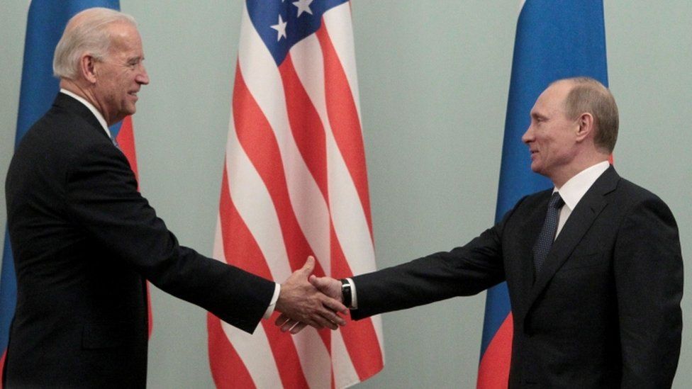 Joe Biden and Vladimir Putin pictured in 2011