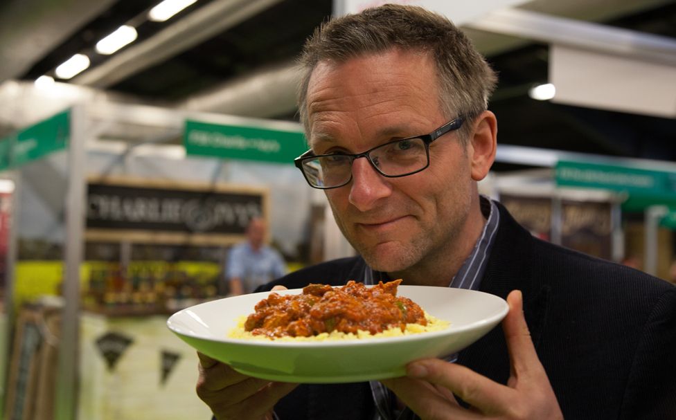 Michael Mosley with a plate of his reheated curry