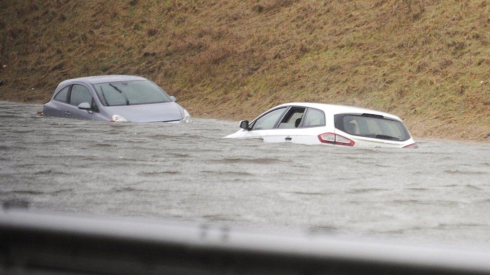 Cars submerged in water in Biggar, Scotland