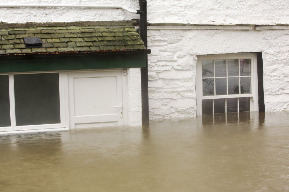 House surrounded by flood waters by the banks of the River Rothay in Ambleside on 5 December 2015 in Cumbria