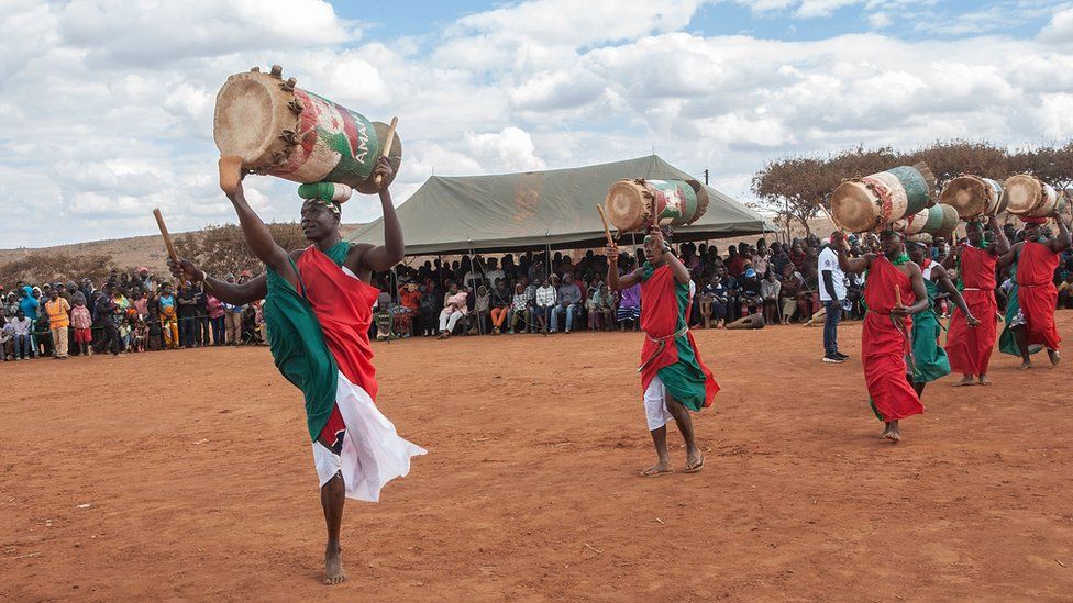 Burundian refugees perform their native Amahoro Cultural Dance to mark World Refugee Day at Dzaleka Refugee Camp in Dowa District Central region of Malawi on June 20, 2018.