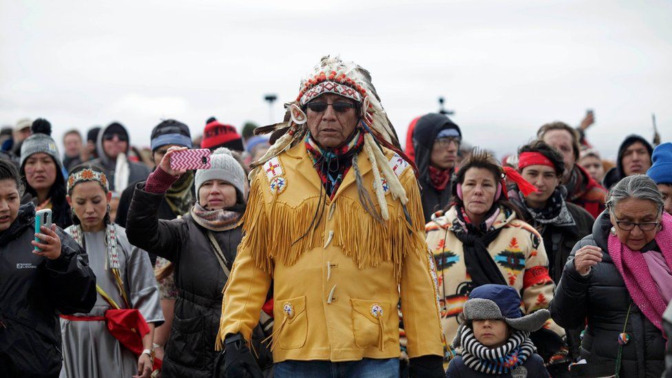 Chief Arvol Looking Horse, spiritual leader of the Sioux Nation, leads his people to peacefully pray near a law enforcement barricade just outside of a Dakota Access pipeline construction site north of Cannon Ball, North Dakota, U.S. October 29, 2016.