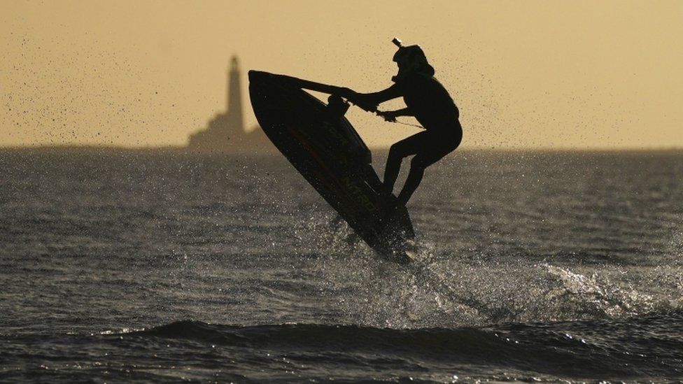 Cameron Holmes flyies through the air on his jet ski at Blyth in Northumberland