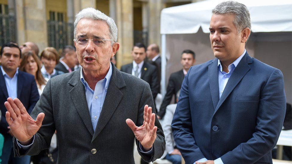 Ivan Duque and Álvaro Uribe (left)