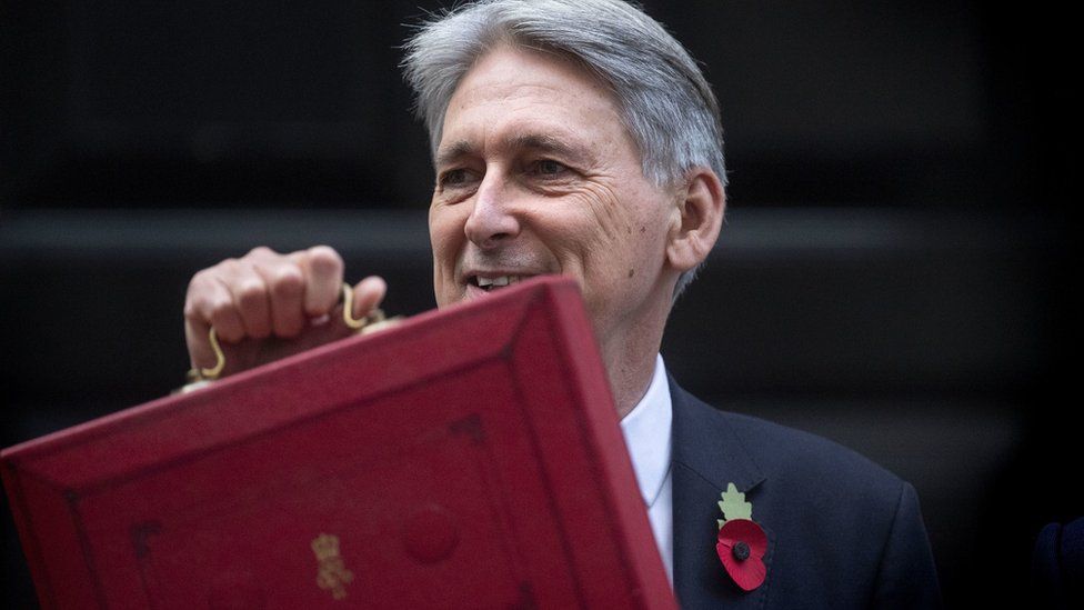 Philip Hammond leaving Downing Street to deliver budget