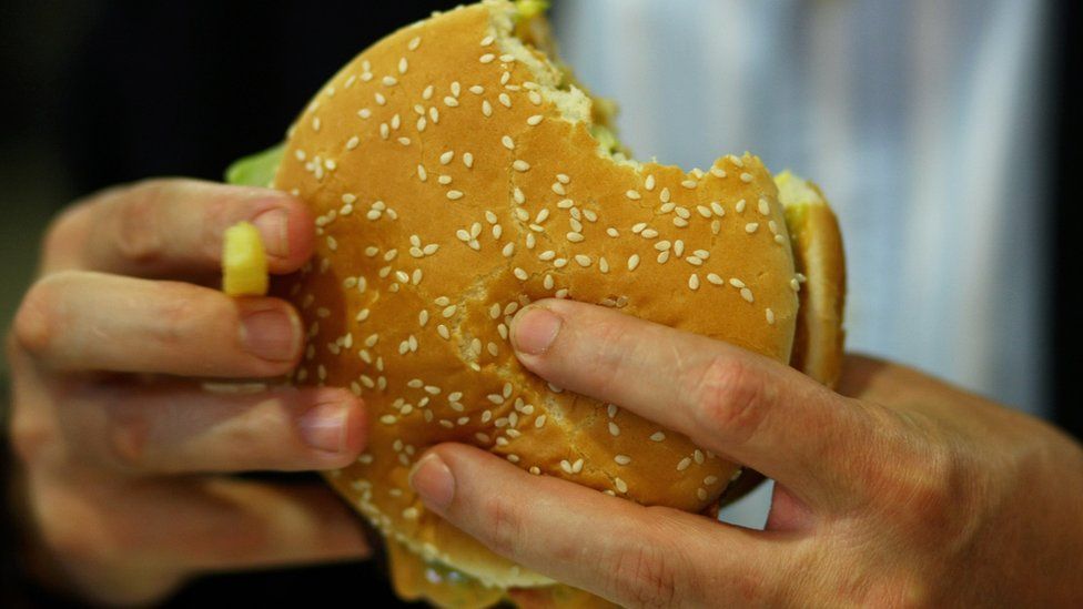 (file Getty photo) Western Australia police have arrested a naked man accused of rifling through a car and stealing a fast food burger.