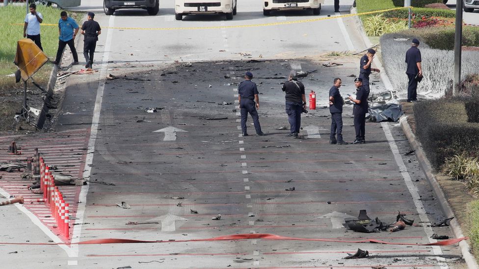 Authorities inspect the scene of a plane crash near Elmina, Malaysia August 17, 2023