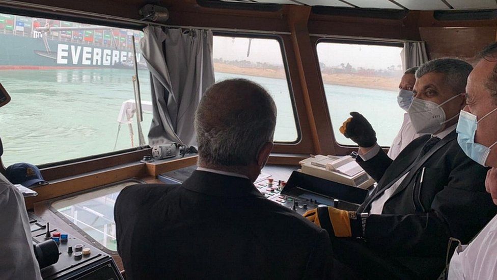 Suez Canal Authority officials visit the stranded ship
