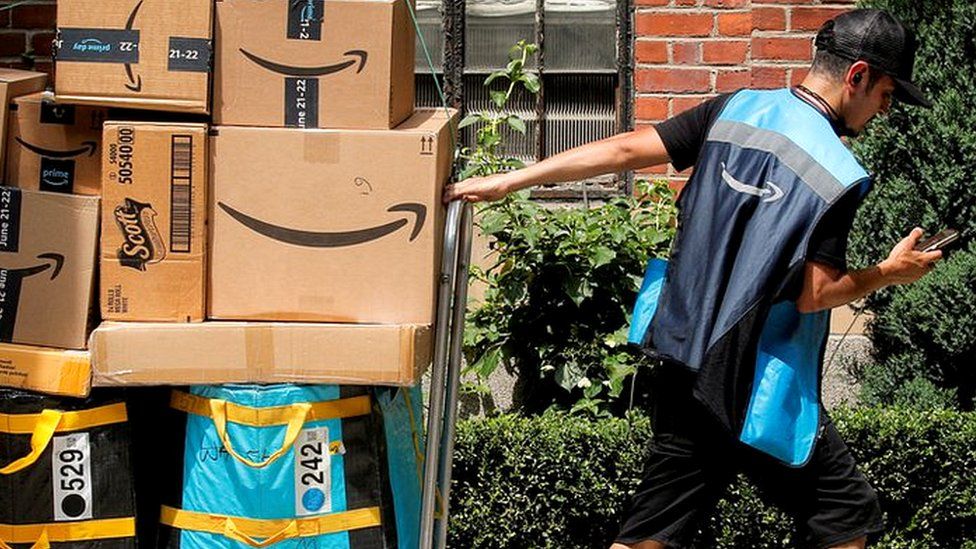 A man with Amazon packages