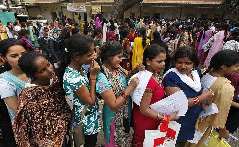A crowd waits to get their names registered at Lal Bagh Employment Office on March 13, 2012 in Lucknow, India.