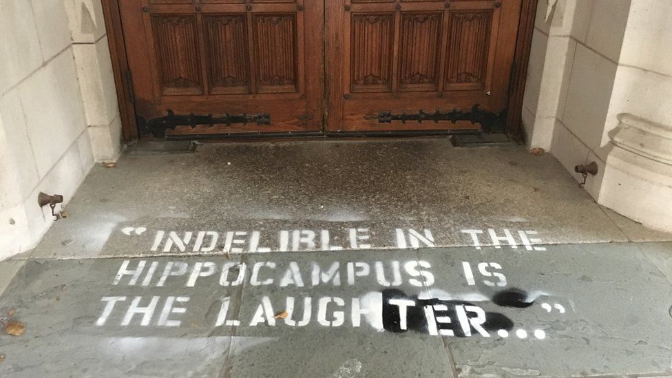 Photo of graffiti on the floor that reads: "Indelible in the hippocampus is the laughter"