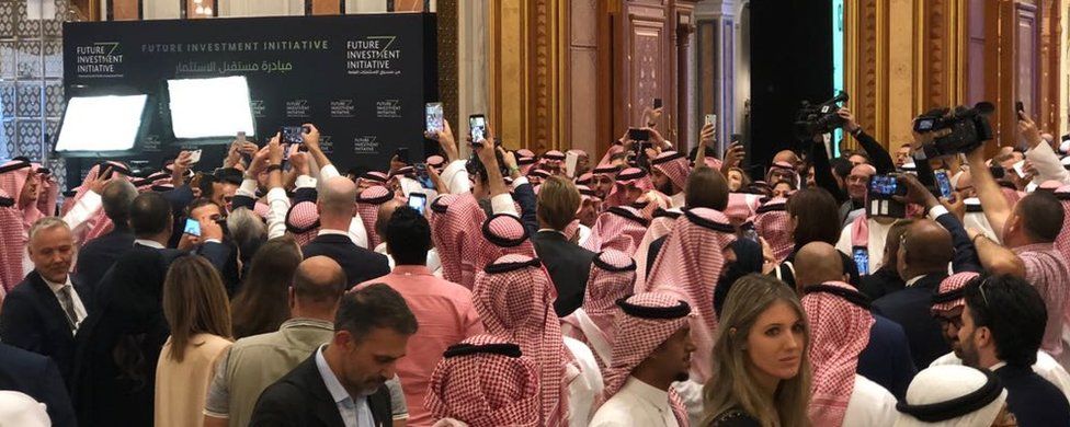 A media scrum as Crown Prince Mohammed bin Salman arrives at the conference