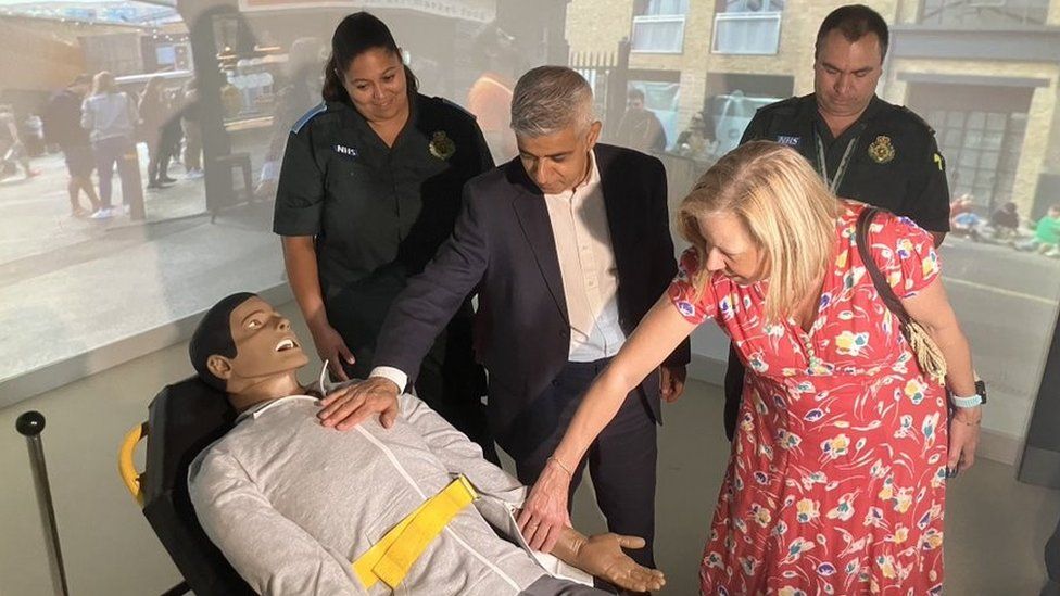 People including Sadiq Khan with a dummy patient