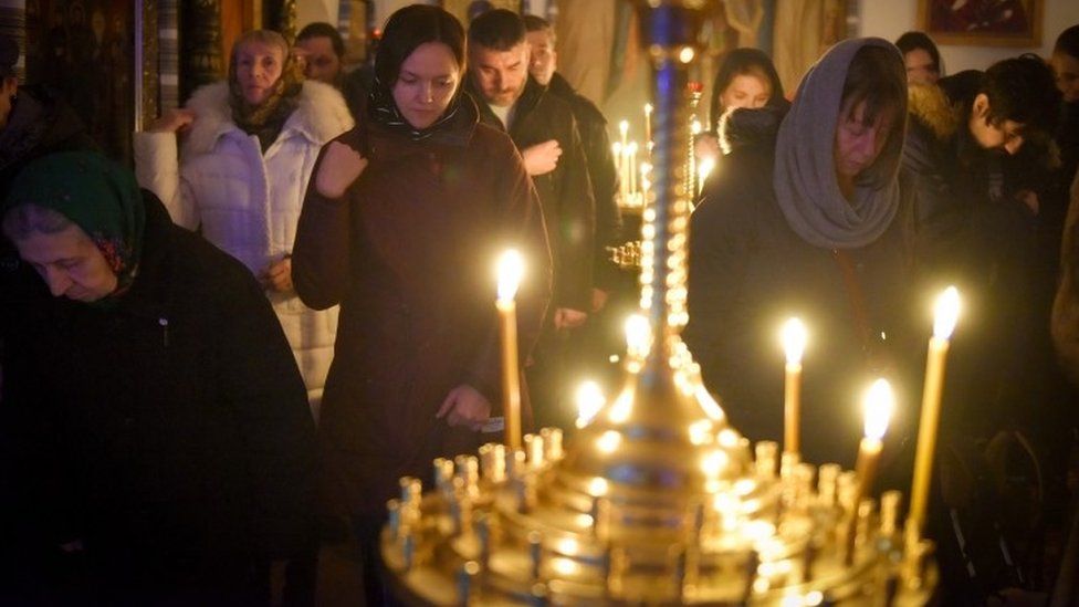 Worshippers attend a Christmas Eve service in Kyiv's Mykhailivsky monastery. Photo: 24 December 2022