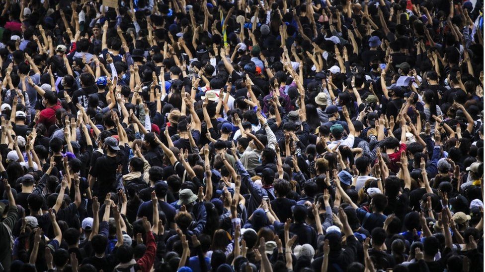 Pro-democracy protesters flash three-finger salute during an anti-government protest in Bangkok, Thailand, 17 October 2020