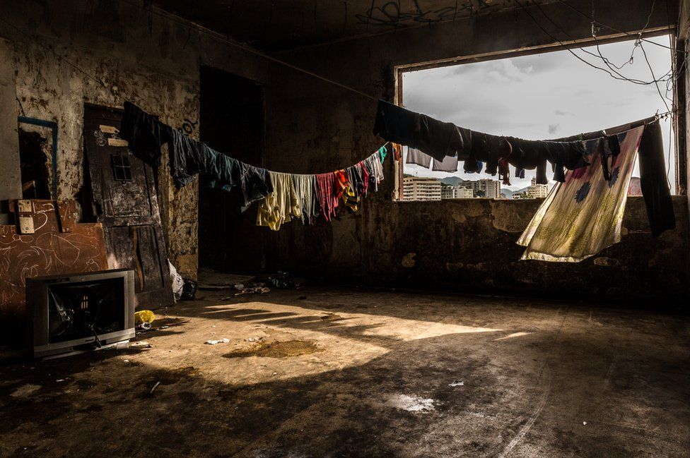 Washing hangs in one of the corridors of the occupied IBGE building. 'Favela' Mangueira community, Rio de Janeiro, Brazil.