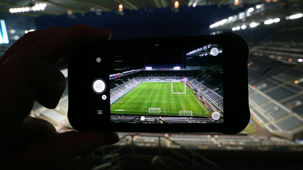 Photographing a football match
