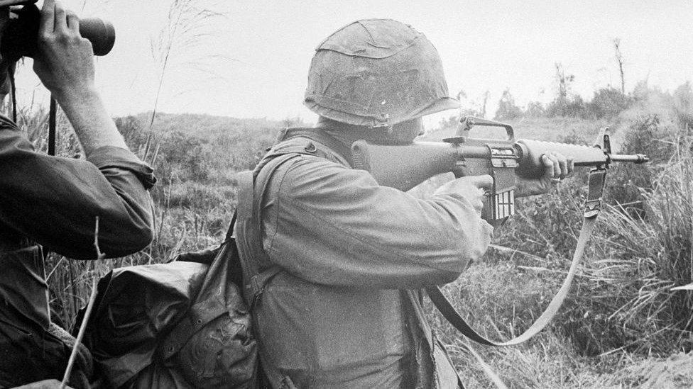 US Marine firing M-16 in Vietnam