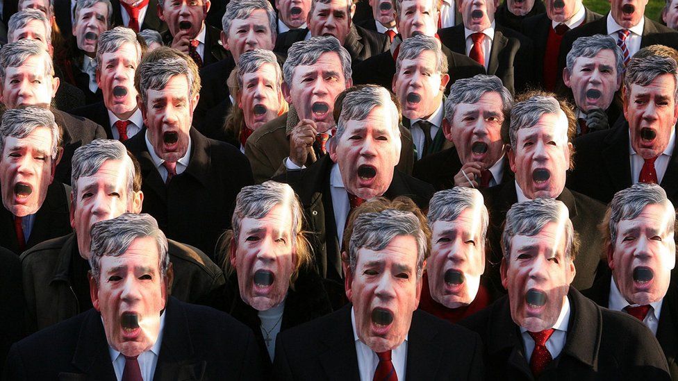 Conservative party activists wear masks of Chancellor Gordon Brown during a protest about tax rises, on March 21, 2007 in London