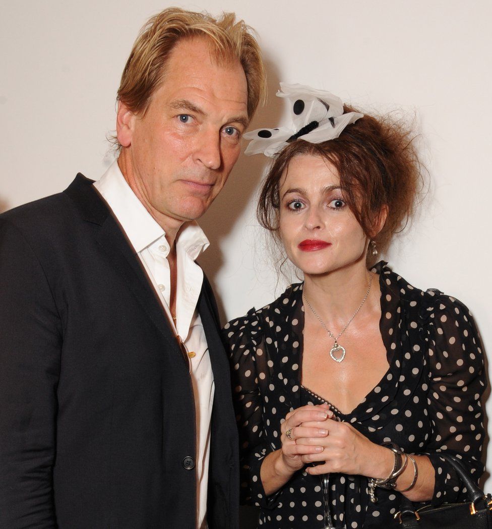 Julian Sands and Helena Bonham Carter attend the private view for Nicole Farhi's debut exhibition of sculptures, 'From The Neck Up' on September 16, 2014 in London, England