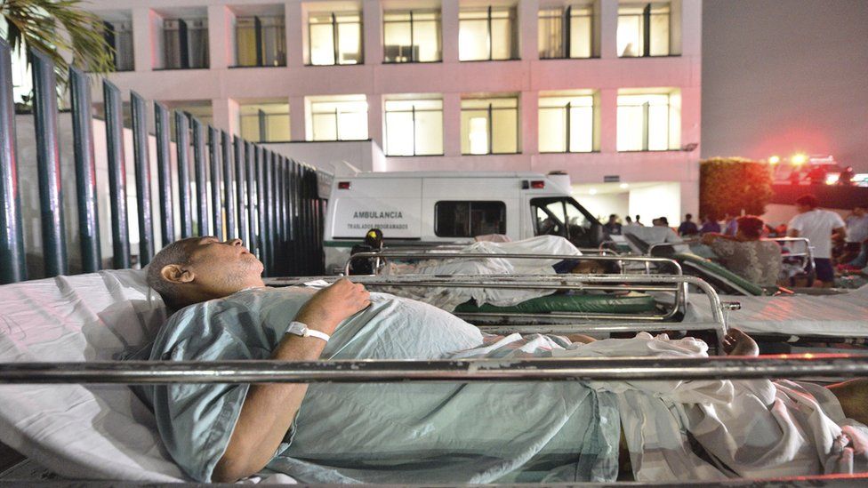 Patients at a hospital in Villahermosa, Mexico, remain in the open after a strong earthquake on 8 September 2017