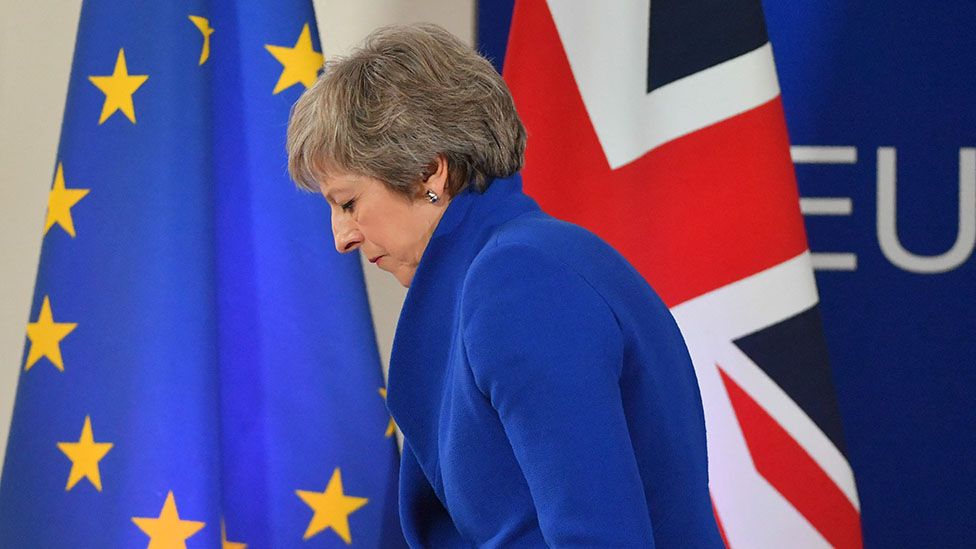 Britain's Prime Minister Theresa May leaves after a press conference following a special meeting of the European Council to endorse the draft Brexit withdrawal agreement and to approve the draft political declaration on future EU-UK relations on November 25, 2018 in Brussels