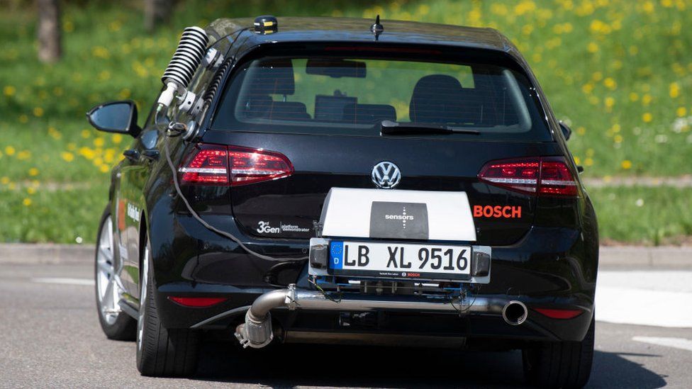 A diesel powered Volkswagen Golf testcar of German electronic and engineering company Bosch measures real drive emissions of NOx with a portable emission measurement system at its rear during a test drive in Stuttgart, southern Germany, on April 17, 2018.