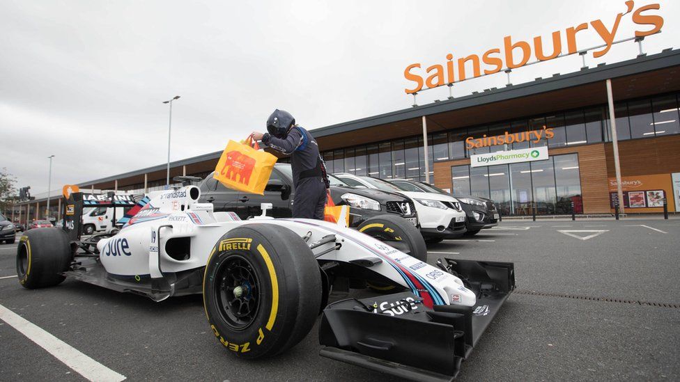 Williams F1 car in front of Sainsbury's