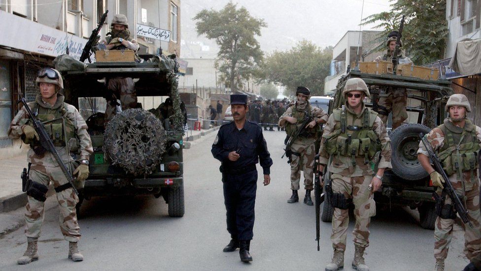 Nato troops secure an area on Chicken Street after a suicide attack targeting soldiers outside a carpet shop in October 2004. An Afghan girl and an American woman were killed.