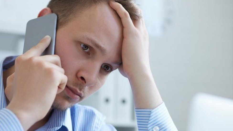 Man frustrated on smartphone
