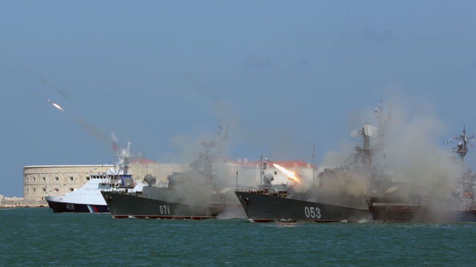 Russian Navy frigates fire missiles during Russia's Navy Day celebration in Sevastopol in Crimea on