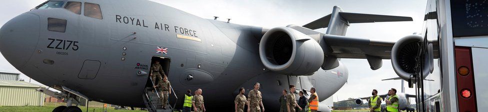 Military personnel arrive at RAF Brize Norton base after being evacuated from Afghanistan