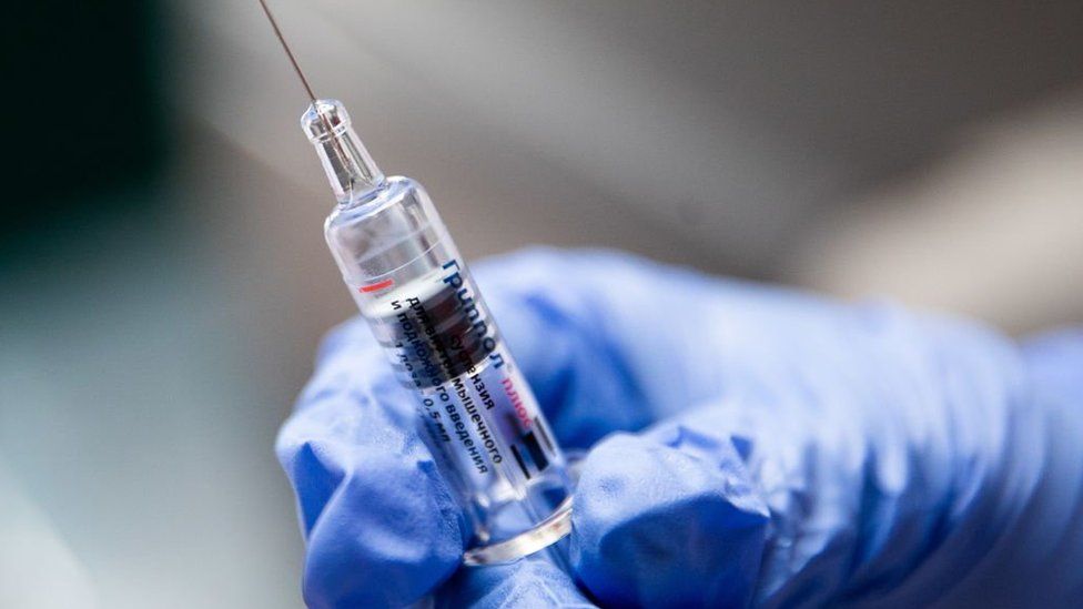 A syringe containing a flu vaccination.