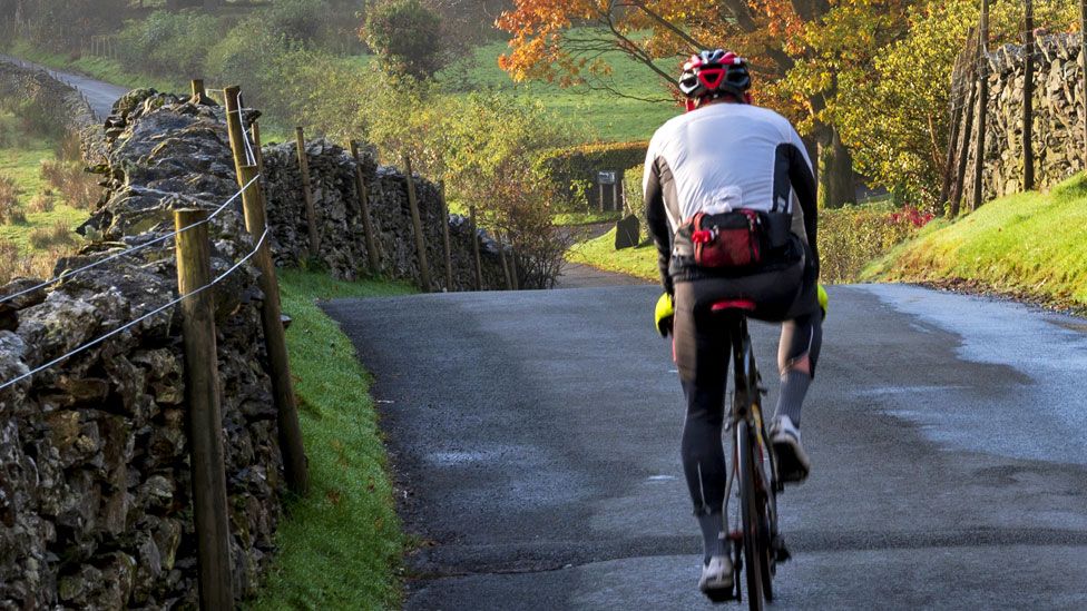 Stock image of a cyclist in the Lake District