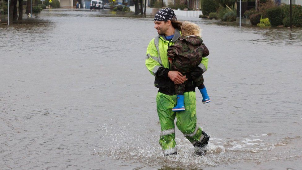 Father and son escape floods